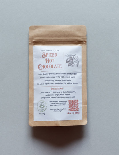 Spiced hot chocolate package with a label on a gray background