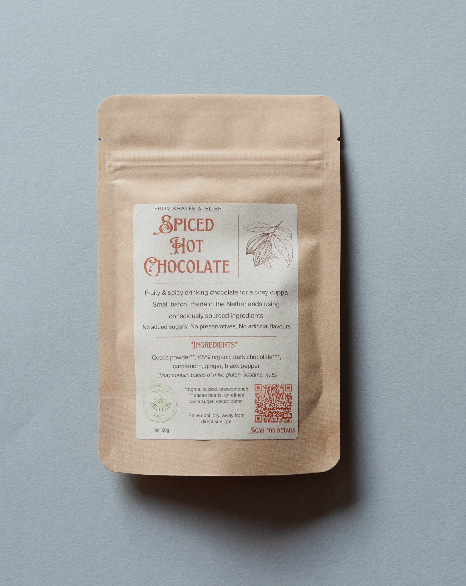 Spiced Hot Chocolate package with a label on a gray background